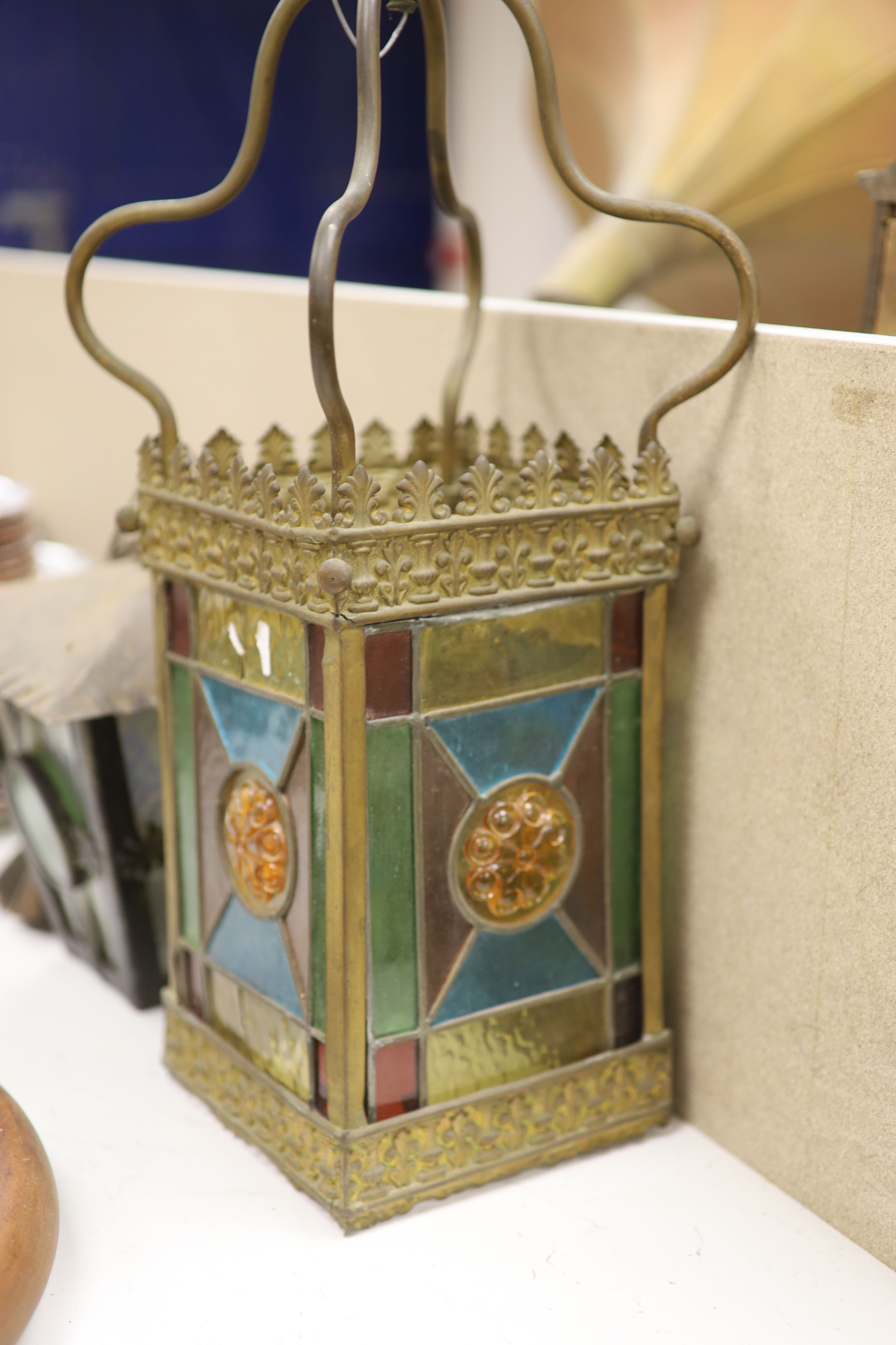 A hanging brass hall lantern and another, drop 50cm